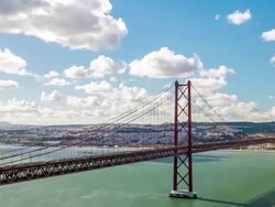 HD Timelapse: Porte 25 de Abril bridge Tagus river Lisbon Stock Footage