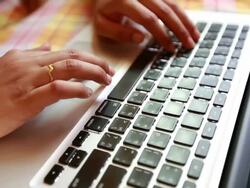 Woman using laptop computer Stock Footage
