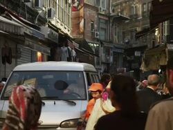 MS Van driving amongst pedestrians walking on busy street / Istanbul,Turkey Stock Footage