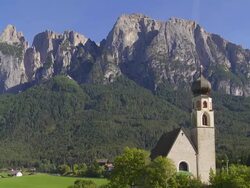 Old Church in Front of Alpine Mountain PAN Stock Footage