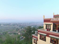 WS View of Kopan Monastery with young monks wandering in balcony / Kathmandu, Central, Nepal Stock Footage