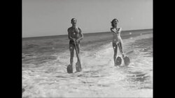 WS TS Young couple waterskiing in sea / United States Stock Footage