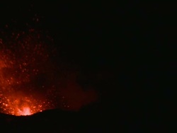 Lava explodes from crater of erupting volcano at night, Stromboli, Italy. March 2010 / AUDIO Stock Footage