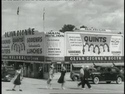 A sign advertises the Dionne Quintuplets News Clip