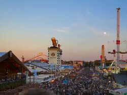 WS T/L Shot of people enjoying at Oktoberfest and full moon from dusk to night / Munich, Bavaria, Germany Stock Footage