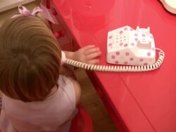 Junior Executive Telephone Skills; Child Talks on Toy Phone Stock Footage