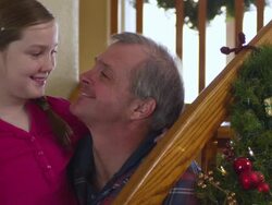 CU Portrait of father and daughter with xmas decorations / Rutland,Vermont, USA Stock Footage