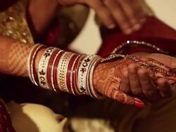 Bride and groom holding hands of each other  Stock Footage