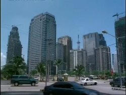 Modern high-rise city buildings and traffic, Ortigas Commercial Centre, Manila, Philippines Stock Footage