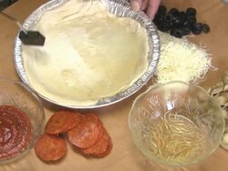 putting oil on pizza crust. Stock Footage