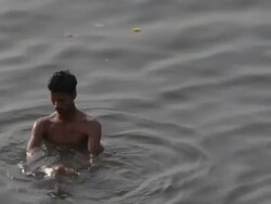 MS HA Man bathing in Ganges river / Varanasi, India Stock Footage