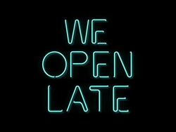 We Open Late neon sign Stock Footage