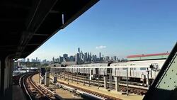 A New York City subway pulling out of a Brooklyn station toward Manhattan, 4K Stock Footage