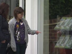 People looking at properties at estate agents News Clip
