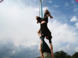 WS Man and woman performing skills on flying trapeze  / Mississauga, Ontario, Canada. Stock Footage