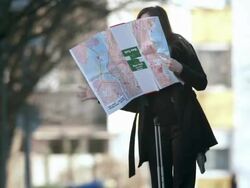 HD: Businesswoman Desperately Looking For Right Direction Stock Footage