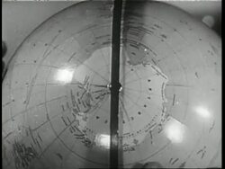 A globe spins showing the continent of Antarctica. News Clip