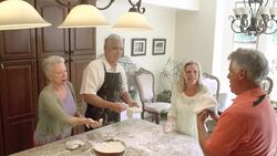 SLOW MOTION - Fun Mature Preparing Food in Kitchen. Stock Footage