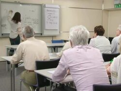 HD DOLLY: Seniors Writing Notes On The Language Course Stock Footage