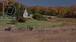 Static shot of a field and a country home in the countryside. Clip 3 Stock Footage