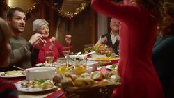 Family doing a funny dance at the festive table Stock Footage