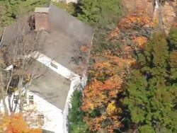 MS AERIAL DS ZI ZO Shot of colonial style house surrounded by tree / Connecticut, United States Stock Footage