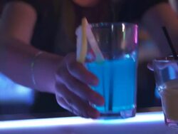 HD: Bartender Passing Glasses Of Drinks Stock Footage