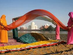Taj Mahal, UNESCO World Heritage Site, across the Jumna (Yamuna) River, Women drying colourful Saris, Agra, Uttar Pradesh state, India, Asia Stock Footage