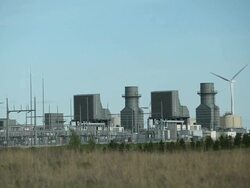 Natural Gas 400 Megawatt Electricity Peaking Plant with Wind Turbines Stock Footage