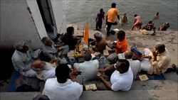 CLEAN : Hindu devotees bathe in the Ganges river News Clip