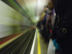 SUBWAY STATION, PEOPLE WAITING, TRAIN ARRIVING (loopable) Stock Footage