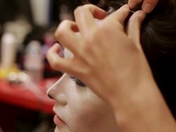 CU young man dressing up and making hairstyle to  impersonate Michael Jackson / Minneapolis, Minnesota, United States  Stock Footage
