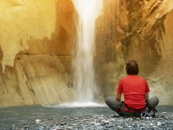 Meditation under the cascade Stock Footage