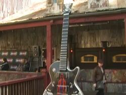 ATMOSPHERE: Guitar at the Ozzy Osbourne Signs a 10-Foot Guitar at The House Of Blues at Hollywood CA. (Footage by WireImage Video/GettyImages) Stock Footage