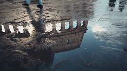 Coliseum reflected in rain water Stock Footage