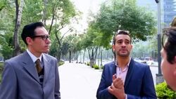 MS PAN Three businessmen standing in discussion on sidewalk of city street Stock Footage