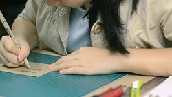 focus dolly : writing handmade paper for your's birthday Stock Footage