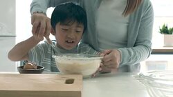 Mother and son baking together Stock Footage