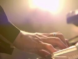 CU Keyboard players hands at concert with white light washing through frame / London, United Kingdom Stock Footage