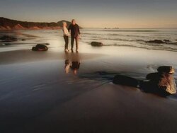 MS Shot of Senior couple walking on beach at sunset / Port Orford, Oregon, United States  Stock Footage