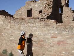 HD video woman explores pueblo ruin Chaco Canyon NHP Stock Footage