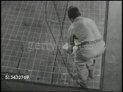 1944: XXI BOMBER COMMAND HEADQUARTERS: VS Headquarters (HQ) of 21st Bomber Command. INT VS Various officers in intelligence room, male mapping out targets on large scale map, another male directing from above. World War II, WWII, strategy, attack plan Instructional Video