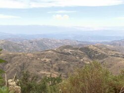 L-R Pan of Oruro mountain ranges from hilltop, Bolivia Stock Footage