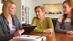 Adult Daughter and Mom Talk with Professional Woman Stock Footage