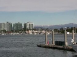 Winter Boating, Snow Capped Mountains behind Tropical Marina Stock Footage