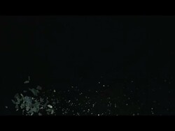 Shards of ice or glass falling against black background Stock Footage