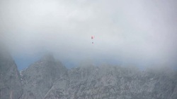 Paraglider flying over the Wilder Kaiser Valley Stock Footage