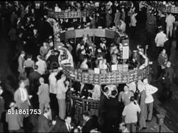 1946: NEW YORK STOCK EXCHANGE: HA WS Crowded trading floor littered w/ paper. HA WS Trading post (booth) on crowded trading floor. 'D' Securities trading board w/ prices. HA WS Group of traders, brokers by trading post camly selling, buying SOT. Instructional Video