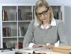 HD DOLLY: Diligent Female Student In The Library Stock Footage