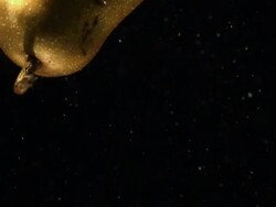 Pear falling into water, black background Stock Footage